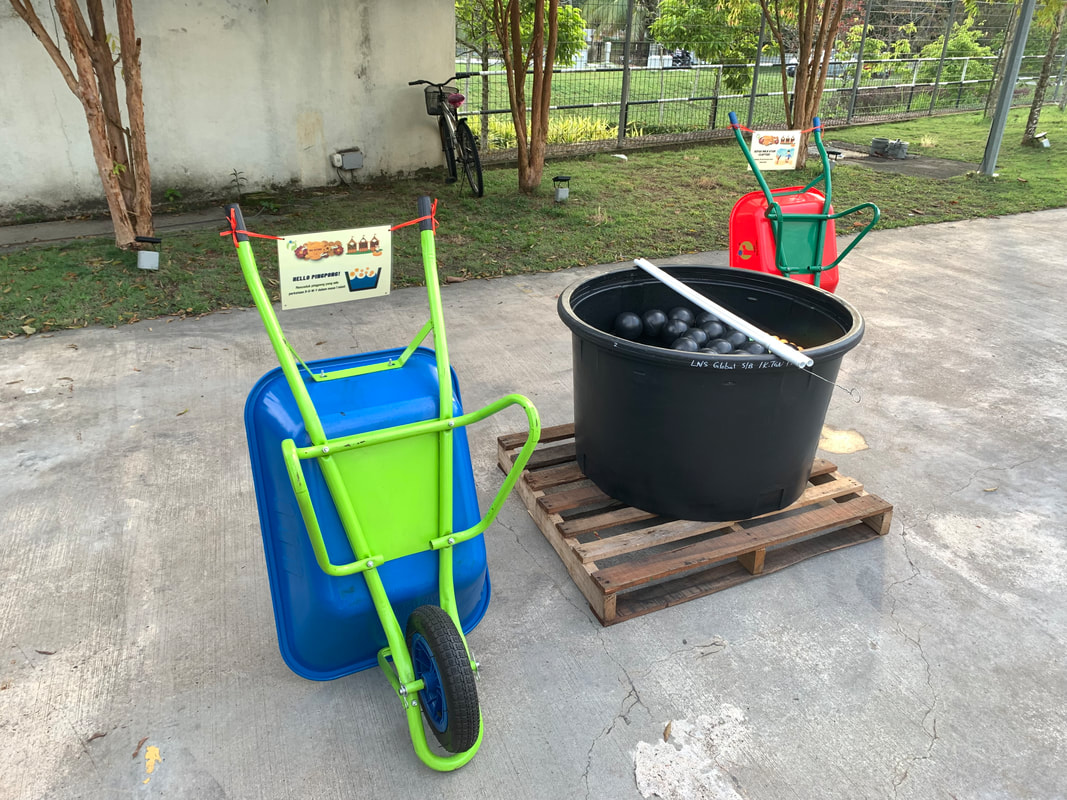 wheelbarrow and poly water tank